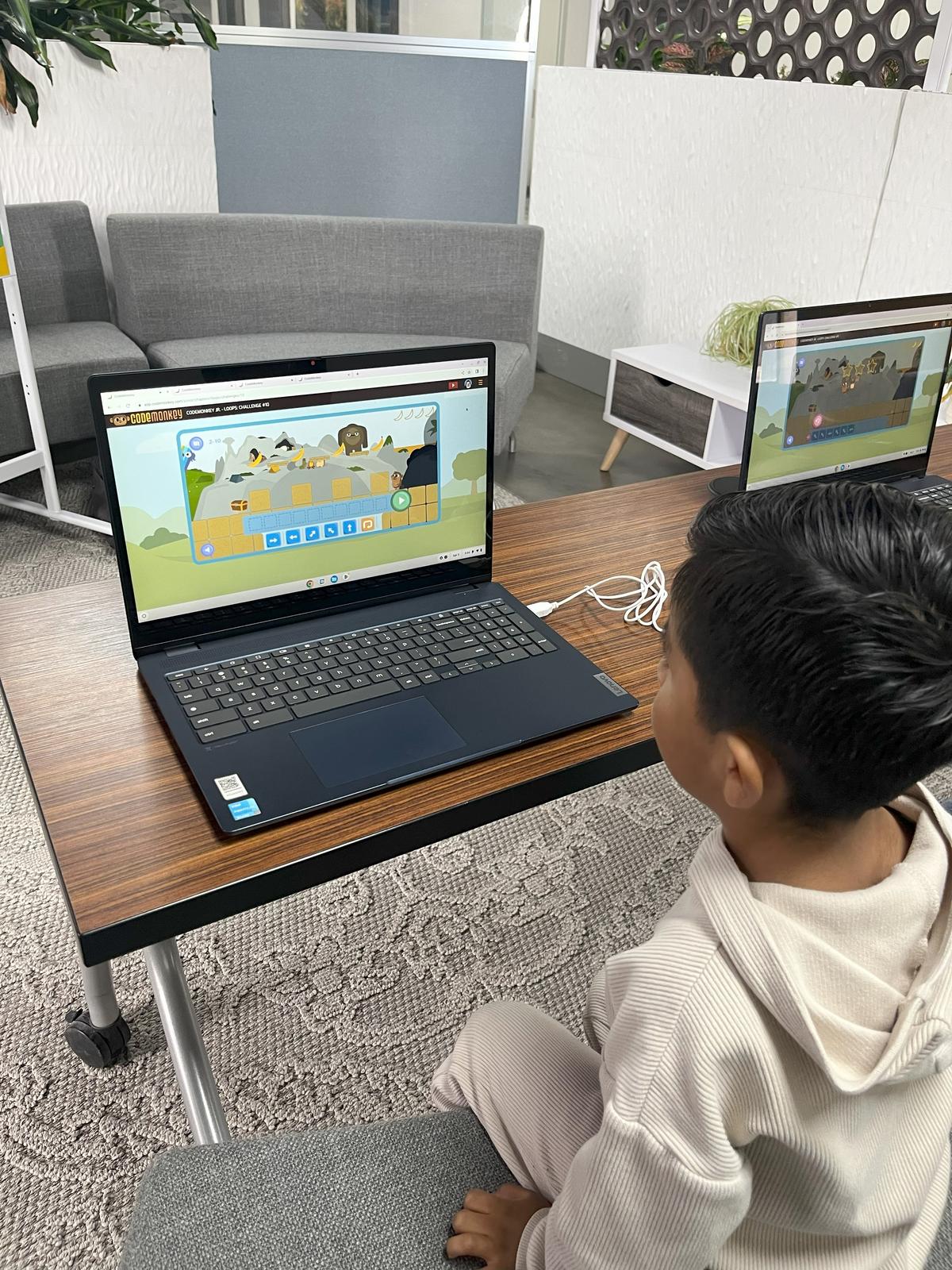 Boy learning logic with CodeMonkey